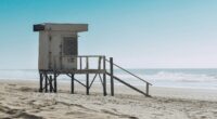 best beaches in Argentina white wooden lifeguard house on beach shore during daytime