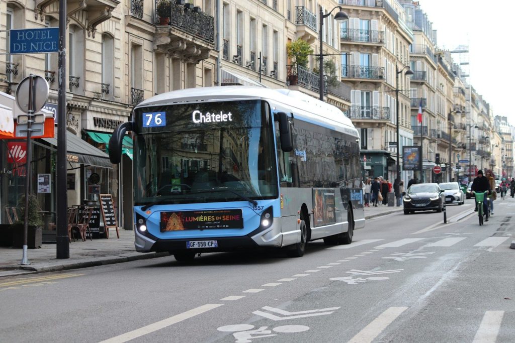 A bus is driving on a city street.